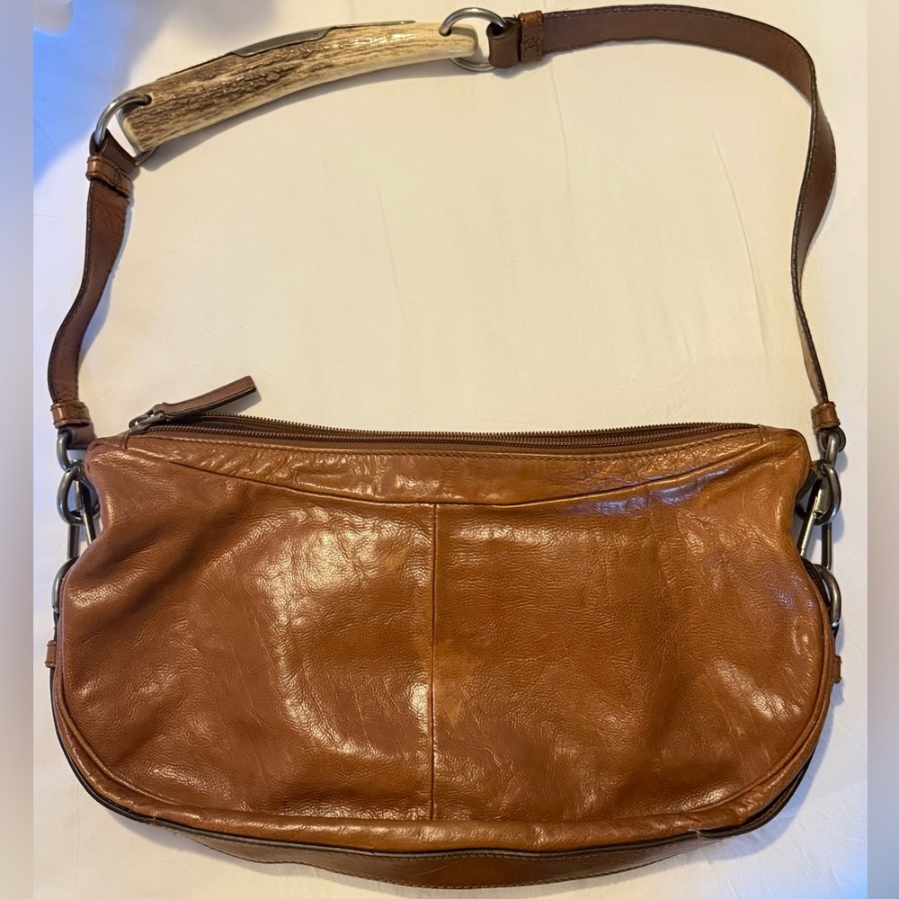 YVES SAINT LAURENT
By Tom Ford SS 2002 Mombasa Horn Hobo Bag
Vintage